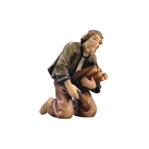 Pastor arrodillado junto al fuego