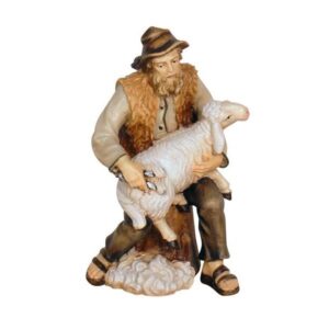 Pastor sentado con ovejas