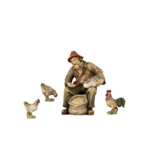 Pastor sentado con galline